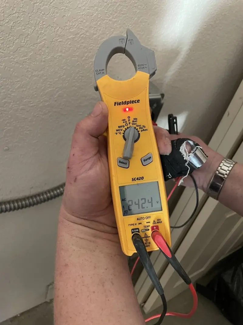 Voltage testing with clamp meter during Generator Installation in Wright
